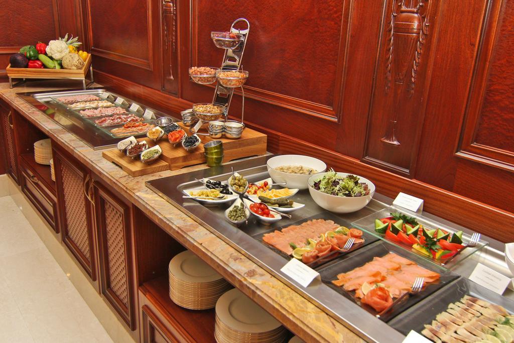 Orion Hotel บิชเคก ภายนอก รูปภาพ A buffet